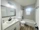 Bathroom with updated fixtures and finishes including white vanity, shower and flooring at 1098 Leeway Ct, Orlando, FL 32810