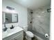 Nicely remodeled bathroom with shower, modern vanity and updated fixtures at 1098 Leeway Ct, Orlando, FL 32810