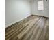 Well-lit bedroom featuring neutral paint and laminate flooring throughout at 1098 Leeway Ct, Orlando, FL 32810