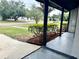 Inviting front yard featuring lush landscaping and a charming covered porch entrance at 1098 Leeway Ct, Orlando, FL 32810