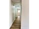 Hallway features modern lighting, neutral paint, and laminate flooring throughout at 1098 Leeway Ct, Orlando, FL 32810