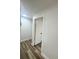 Hallway features modern lighting, neutral paint, and laminate flooring throughout at 1098 Leeway Ct, Orlando, FL 32810