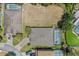 Aerial view showcasing the home's roof, landscaping, and screened-in pool area at 1103 Cypress Pointe Blvd, Davenport, FL 33896