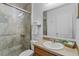 Neutral bathroom featuring a glass enclosed shower, single vanity, and white toilet at 1103 Cypress Pointe Blvd, Davenport, FL 33896