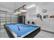 Open garage space with a pool table and washer/dryer hookups at 1103 Cypress Pointe Blvd, Davenport, FL 33896