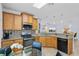 Kitchen showcases stone countertops, modern stainless appliances, and mosaic backsplash at 1103 Cypress Pointe Blvd, Davenport, FL 33896
