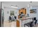 Eat-in kitchen features granite countertops, stainless steel appliances, and a cozy breakfast nook at 1103 Cypress Pointe Blvd, Davenport, FL 33896