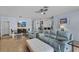 Bright, open-concept living space with comfortable seating, a dining area, and breakfast bar at 1103 Cypress Pointe Blvd, Davenport, FL 33896