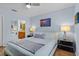 Comfortable main bedroom with wood floors and view of ensuite bathroom at 1103 Cypress Pointe Blvd, Davenport, FL 33896