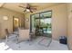 Covered patio with dining set, ceiling fan, and a view of the pool area at 1103 Cypress Pointe Blvd, Davenport, FL 33896