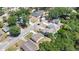 Aerial view of a residential area with mature trees and diverse housing styles at 118 Deacon Jones Blvd, Orlando, FL 32810