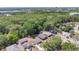 Residential area boasting a canopy of mature trees near lakes and city skyline at 118 Deacon Jones Blvd, Orlando, FL 32810