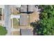 Birds eye view of single Gathering homes, streets and mature tree coverage at 118 Deacon Jones Blvd, Orlando, FL 32810