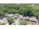 An aerial view of residential houses nestled within lush greenery, creating a serene neighborhood ambiance at 118 Deacon Jones Blvd, Orlando, FL 32810