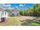 Large backyard with shade trees and plenty of space for outdoor activities and landscaping at 118 Deacon Jones Blvd, Orlando, FL 32810