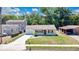 A well-kept residence boasting a green lawn and freshly painted exterior in a friendly neighborhood at 118 Deacon Jones Blvd, Orlando, FL 32810