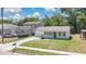 A charming home featuring a manicured lawn and inviting curb appeal in a desirable neighborhood at 118 Deacon Jones Blvd, Orlando, FL 32810
