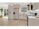 Bright kitchen features stainless steel appliances, white cabinets and modern finishes at 118 Deacon Jones Blvd, Orlando, FL 32810