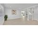 Bright and airy living room with wood flooring, fresh paint, and an open floor plan to the kitchen at 118 Deacon Jones Blvd, Orlando, FL 32810