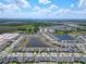 Aerial view of a well-planned community with lakes, green spaces, and residential areas at 1181 Lone Palm Way, St Cloud, FL 34771
