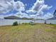 Large fenced backyard with lounge seating area, perfect for outdoor enjoyment at 1181 Lone Palm Way, St Cloud, FL 34771