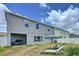 Home's backyard showcasing the covered patio and outdoor living space at 1181 Lone Palm Way, St Cloud, FL 34771