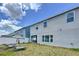 Rear of the home highlighting the large, fenced backyard and outdoor space at 1181 Lone Palm Way, St Cloud, FL 34771