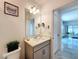 Bathroom featuring a modern vanity, updated light fixture, and neutral paint at 1181 Lone Palm Way, St Cloud, FL 34771