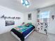 bedroom with bright decor and unique wall art, creating a lively and fun space at 1181 Lone Palm Way, St Cloud, FL 34771