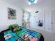 bedroom with creative decor and unique wall art, creating a lively and fun space at 1181 Lone Palm Way, St Cloud, FL 34771