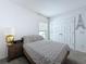 Bedroom featuring neutral walls, carpet floor, and double-door closet at 1181 Lone Palm Way, St Cloud, FL 34771
