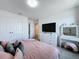 Bedroom with neutral walls, plush bed, and a vanity area, offering a cozy retreat at 1181 Lone Palm Way, St Cloud, FL 34771