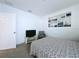 Neutral bedroom featuring a TV and scenic artwork at 1181 Lone Palm Way, St Cloud, FL 34771