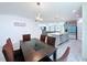 Dining area with a view of the kitchen and living room showcasing an open concept design at 1181 Lone Palm Way, St Cloud, FL 34771