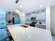 Modern kitchen featuring a large island with quartz countertops and stainless steel appliances at 1181 Lone Palm Way, St Cloud, FL 34771