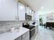 Updated kitchen featuring stainless steel appliances, modern backsplash, and ample counter space at 1181 Lone Palm Way, St Cloud, FL 34771