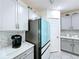 Kitchen featuring modern appliances, quartz countertops, and ample cabinet space at 1181 Lone Palm Way, St Cloud, FL 34771