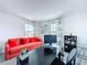 Office space with a bright sofa and desk with natural light at 1181 Lone Palm Way, St Cloud, FL 34771