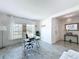 Well-lit home office with large windows, marble-topped desk, and elegant, modern finishes at 1181 Lone Palm Way, St Cloud, FL 34771