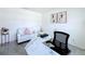 Comfortable office space featuring a white couch, marble desk, and modern decor at 1181 Lone Palm Way, St Cloud, FL 34771