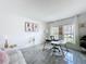 Spacious home office featuring a marble-topped desk, ample natural light, and contemporary decor at 1181 Lone Palm Way, St Cloud, FL 34771