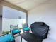 Cozy covered patio with comfortable seating, perfect for relaxing and grilling outdoors at 1181 Lone Palm Way, St Cloud, FL 34771