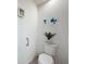 Toilet room featuring a white toilet with decor and chrome handle at 1181 Lone Palm Way, St Cloud, FL 34771
