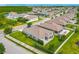 Aerial view of the home highlighting the landscaped yard and patio, in a well-maintained neighborhood at 12313 Prairie Plantation Way, Orlando, FL 32824