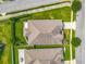 Aerial shot of house showing the layout of the roof, yard, and neighborhood streets at 12313 Prairie Plantation Way, Orlando, FL 32824