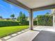 Relaxing view of the backyard and landscaping from the covered patio at 12313 Prairie Plantation Way, Orlando, FL 32824