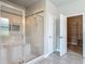 Luxurious bathroom with a walk-in shower and a separate bathtub at 12313 Prairie Plantation Way, Orlando, FL 32824