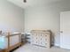 Neutral Bedroom features a changing table, bassinet, and clean, organized space with ample storage at 12313 Prairie Plantation Way, Orlando, FL 32824