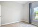 Serene bedroom with a window offering a green view and blue curtains at 12313 Prairie Plantation Way, Orlando, FL 32824