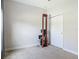 Bright bedroom has a wooden rowing machine and a white door leading to closet or bathroom at 12313 Prairie Plantation Way, Orlando, FL 32824